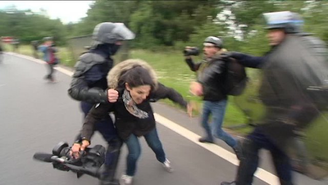 Police forces pushed and hit journalists with batons while dispersing a protest against a proposed labour law in Rennes, France, June 2016